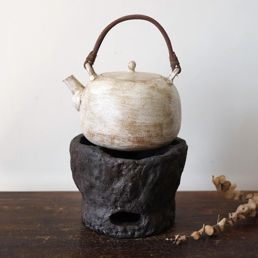 Rustic charcoal stove with Teapot